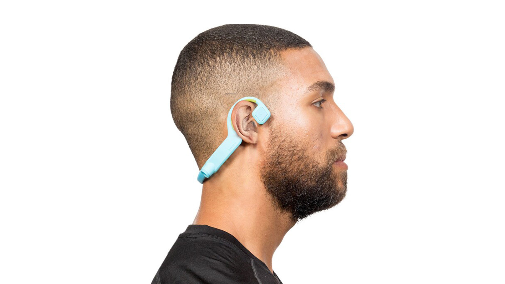 Woman with hearing aid surround by people with headphones