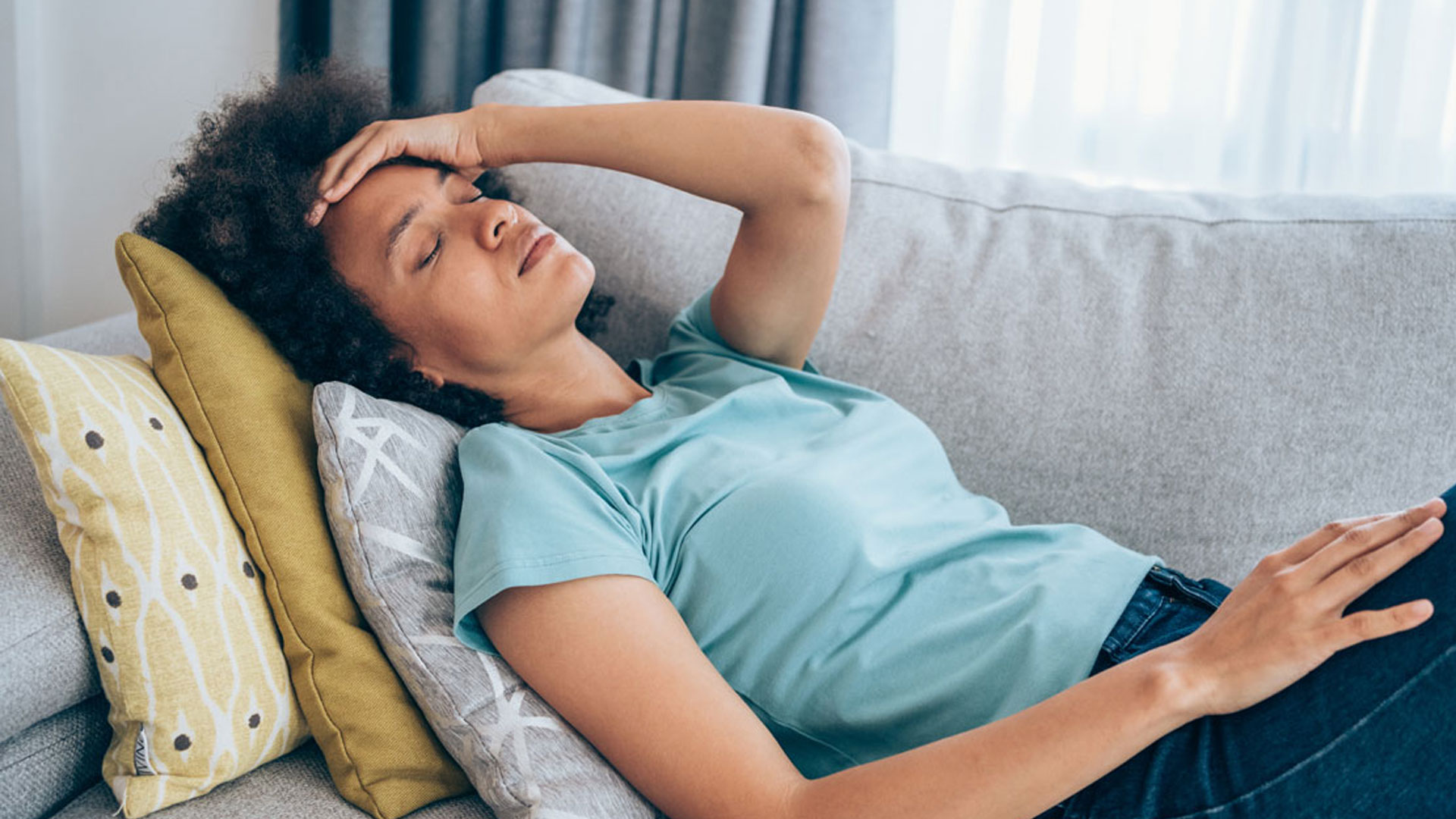 Anemic woman lying down exhausted