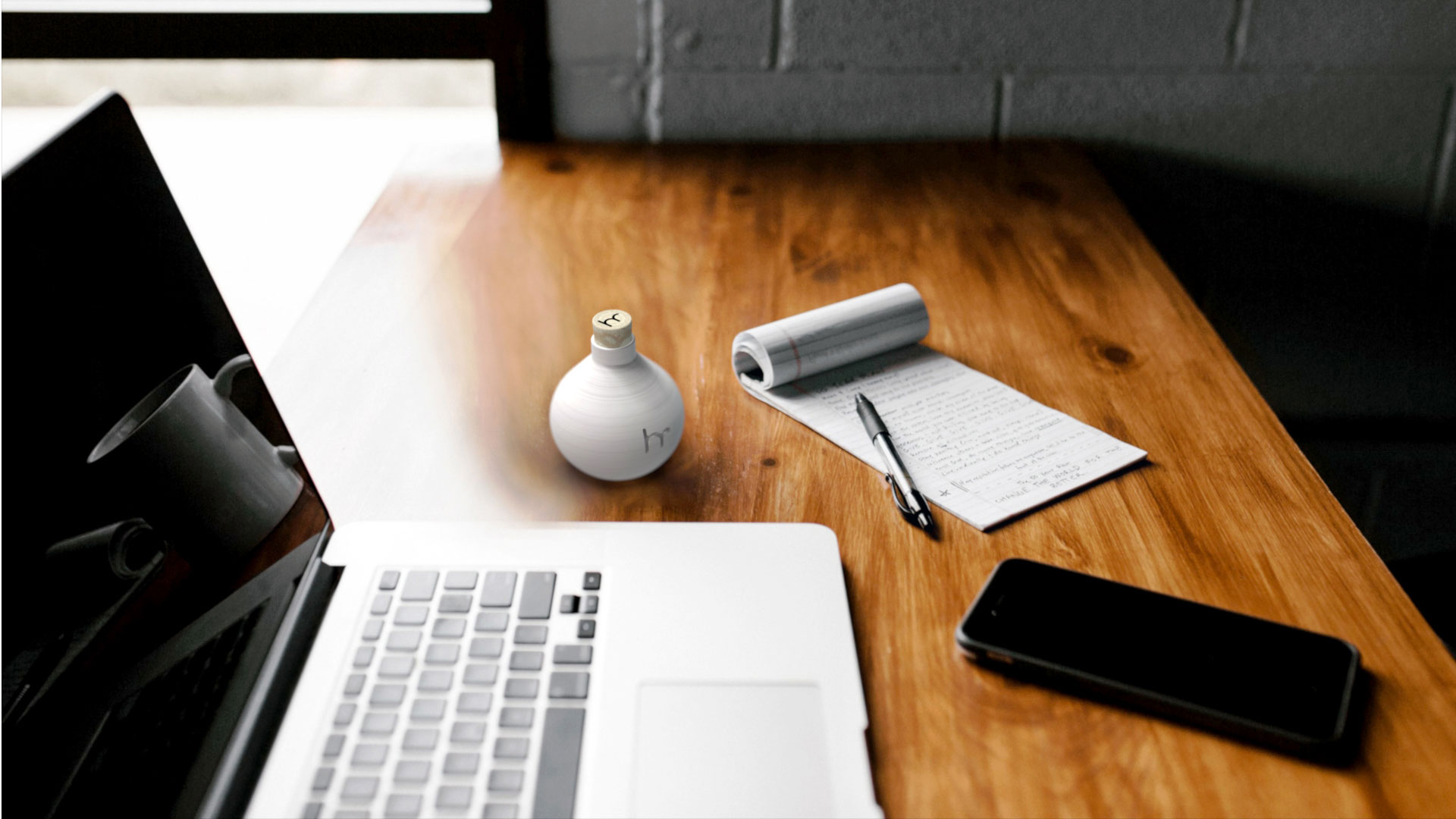 Drop water bottle being used on desk