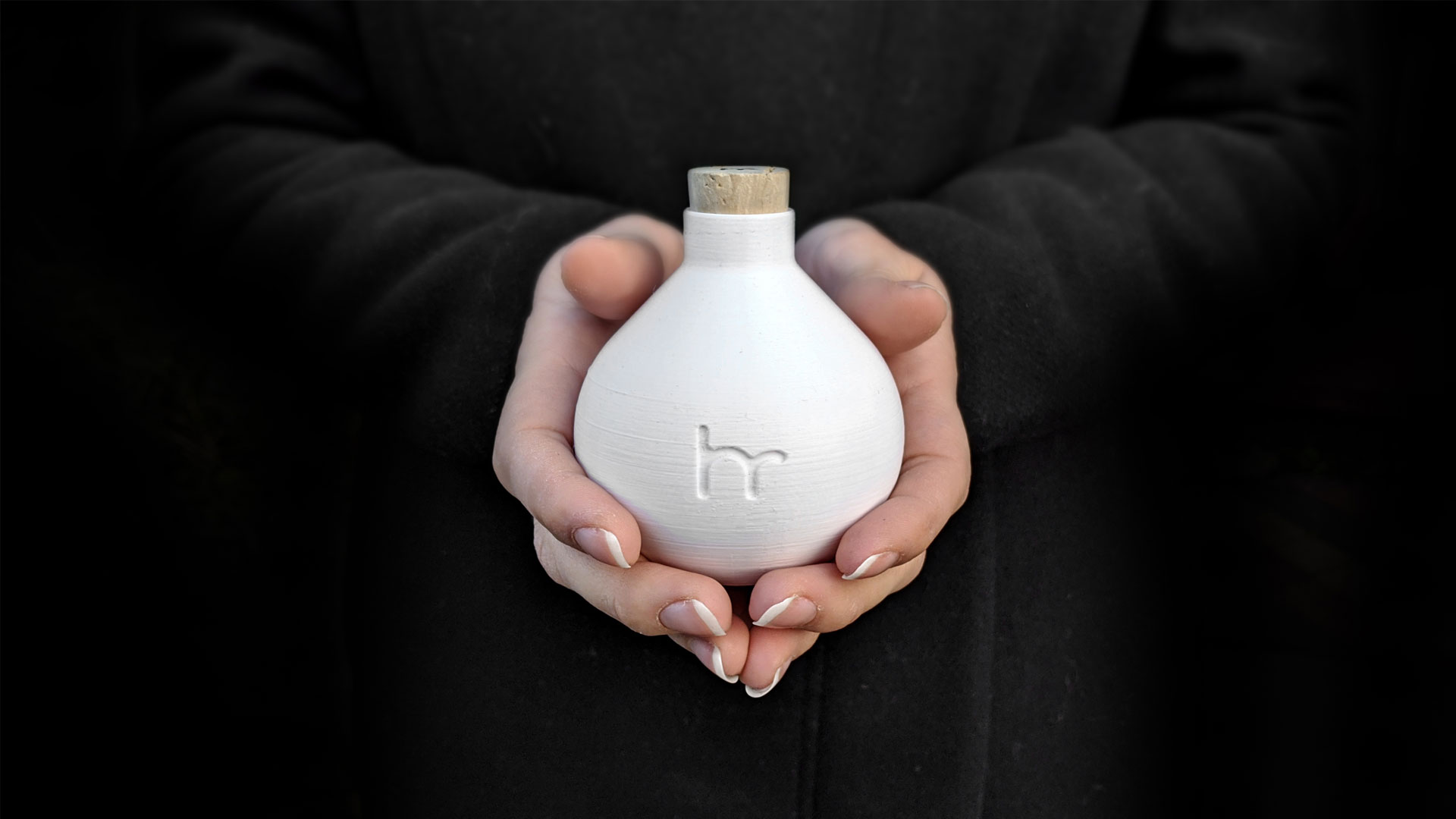 woman's hands holding drop water bottle
